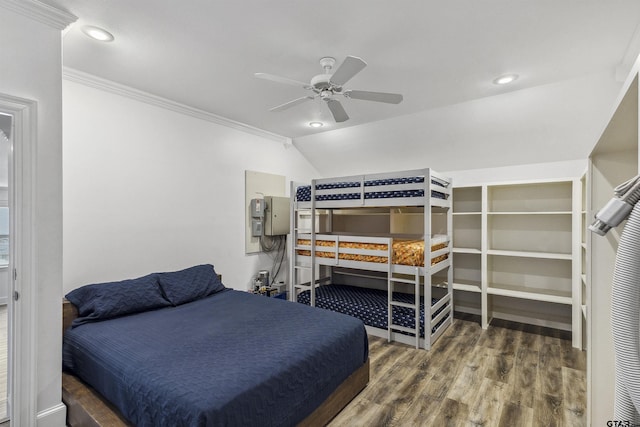 bedroom with ornamental molding, lofted ceiling, dark wood-type flooring, and ceiling fan