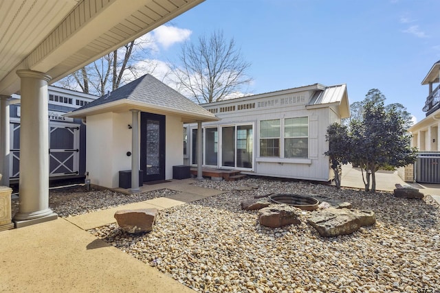 exterior space featuring central air condition unit