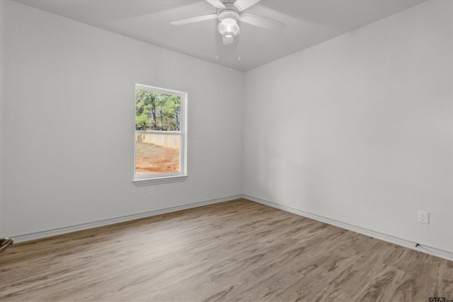 unfurnished room with ceiling fan and light hardwood / wood-style floors