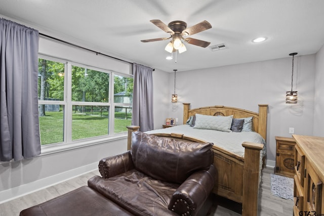 bedroom with wood finished floors, visible vents, baseboards, ceiling fan, and recessed lighting