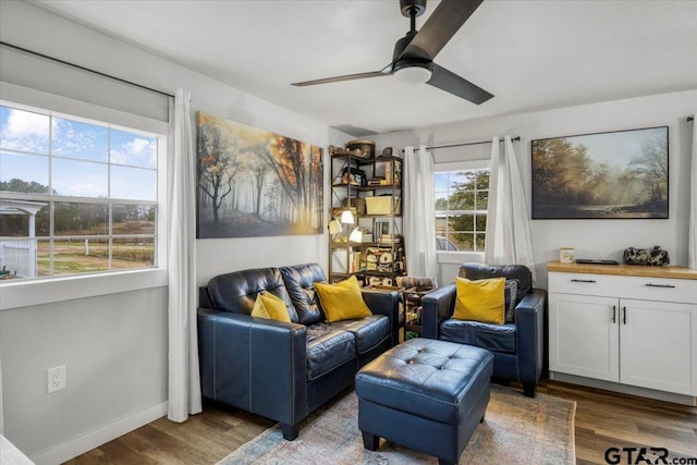 sitting room featuring hardwood / wood-style flooring and ceiling fan