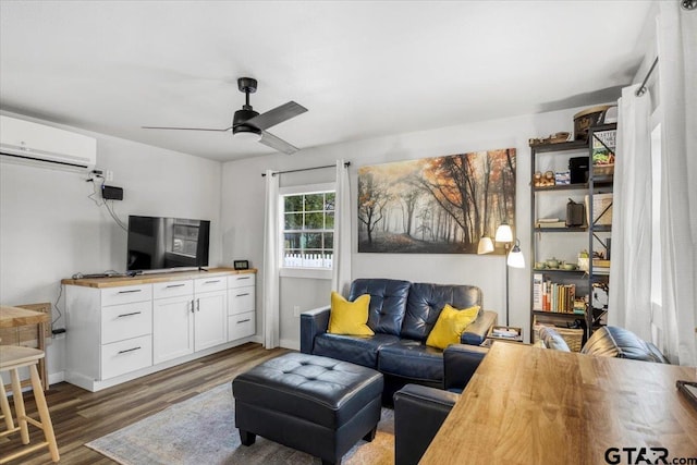 living room featuring dark wood-type flooring, ceiling fan, and a wall mounted air conditioner