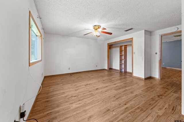 709 E Magnolia St, Troup, TX 75789 - kitchen with white appliances, a sink, white cabinets, and a textured ceiling