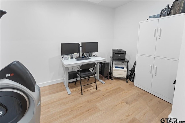 office space with light hardwood / wood-style floors