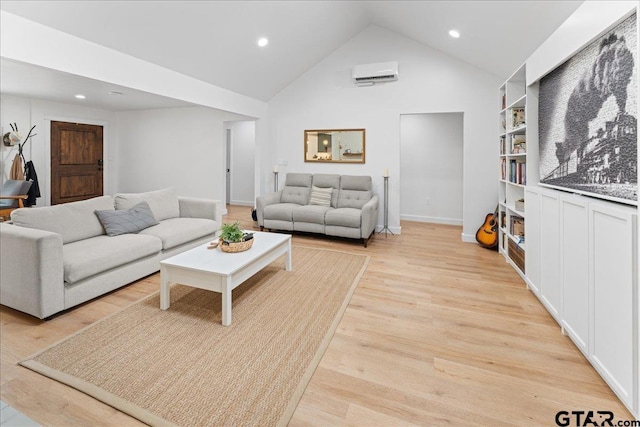 living room with light wood-type flooring, a wall mounted AC, built in features, and high vaulted ceiling