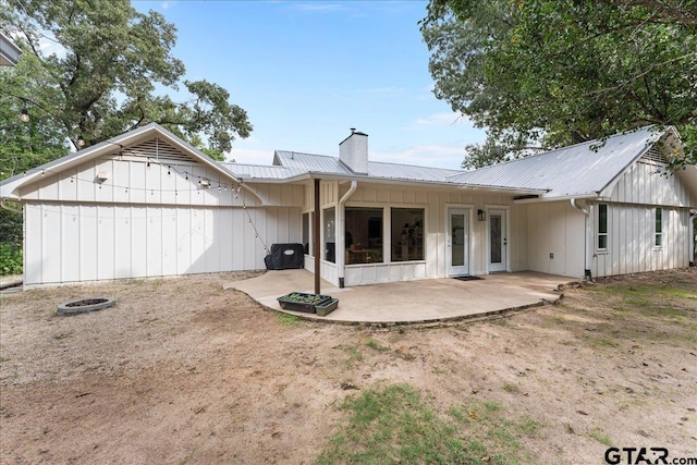 rear view of property featuring a patio