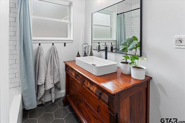 bathroom with shower / bath combination with curtain, tile patterned floors, and vanity