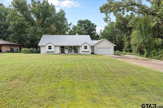 ranch-style home with a front lawn and a garage