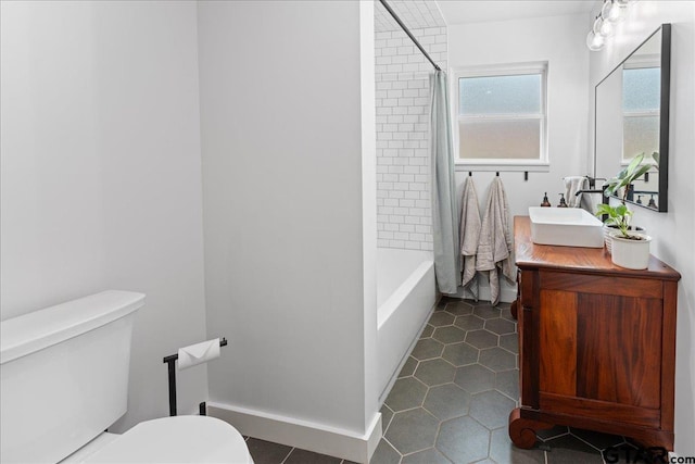 full bathroom featuring toilet, tile patterned flooring, shower / tub combo, and vanity