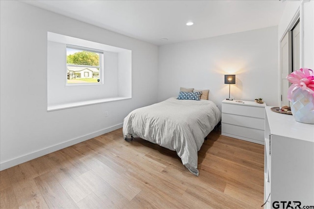 bedroom with light wood-type flooring