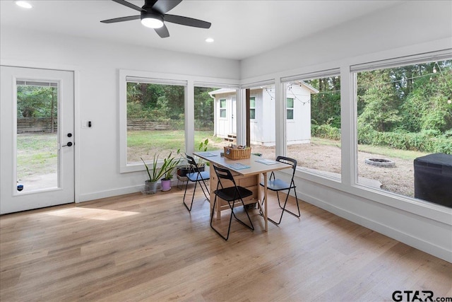 sunroom / solarium with ceiling fan