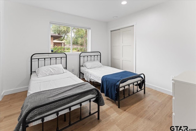 bedroom featuring a closet and light hardwood / wood-style floors