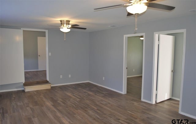 empty room with dark wood-type flooring