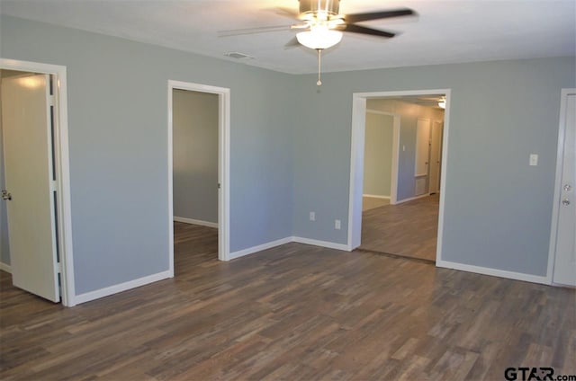 unfurnished bedroom with dark hardwood / wood-style floors and ceiling fan