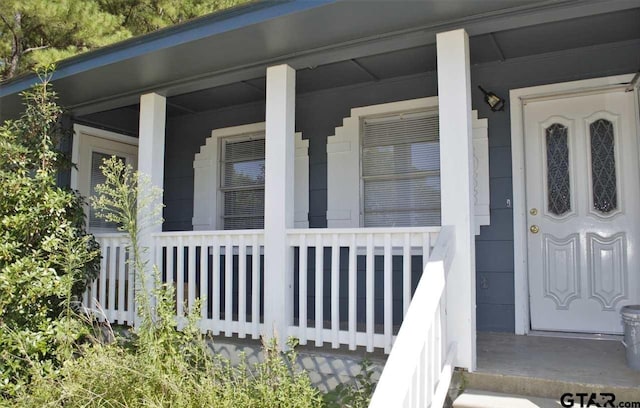 doorway to property with a porch