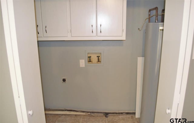 washroom with hookup for an electric dryer, cabinets, and washer hookup