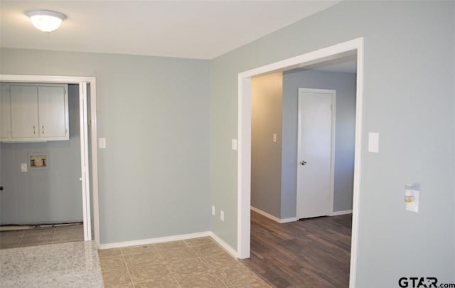 empty room with light hardwood / wood-style flooring