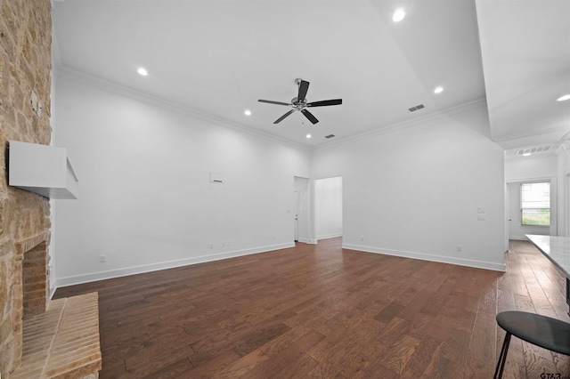 4132 Palo Pinto Creek Cir, Tyler, TX 75703 - unfurnished living room with ceiling fan, wood finished floors, ornamental molding, a large fireplace, and recessed lighting