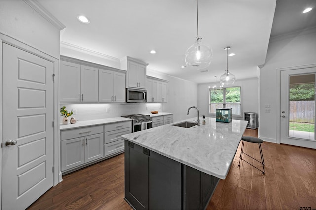 4132 Palo Pinto Creek Cir, Tyler, TX 75703 - kitchen featuring appliances with stainless steel finishes, a sink, recessed lighting, backsplash, and a spacious island