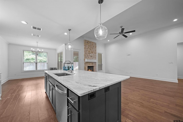 4132 Palo Pinto Creek Cir, Tyler, TX 75703 - kitchen with a sink, dishwasher, crown molding, a fireplace, and open floor plan