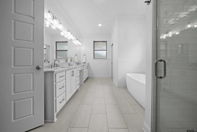 4132 Palo Pinto Creek Cir, Tyler, TX 75703 - bathroom featuring crown molding, double vanity, a stall shower, a soaking tub, and tile patterned floors
