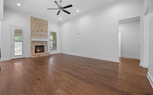 4132 Palo Pinto Creek Cir, Tyler, TX 75703 - unfurnished living room with a ceiling fan, crown molding, dark wood finished floors, a fireplace, and baseboards