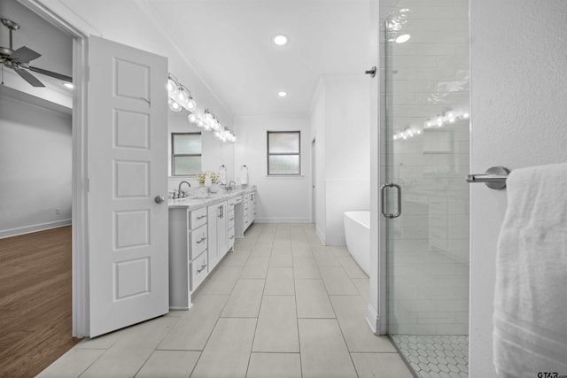 4132 Palo Pinto Creek Cir, Tyler, TX 75703 - full bath featuring crown molding, a stall shower, a freestanding tub, double vanity, and ceiling fan