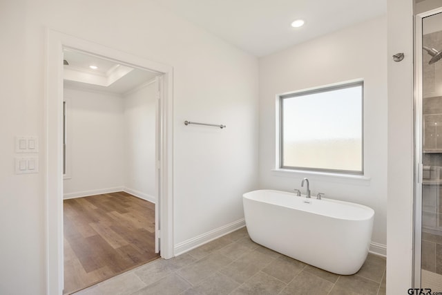482 Mary Cir, Bullard, TX 75757 - bathroom with a tile shower, a soaking tub, recessed lighting, baseboards, and crown molding