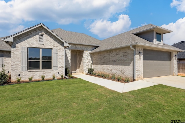 482 Mary Cir, Bullard, TX 75757 - view of front facade with brick siding, a front yard, a shingled roof, and concrete driveway