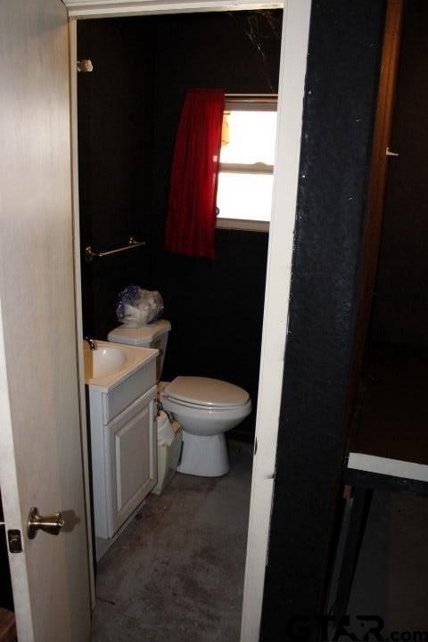 307 Lowry St, Arp, TX 75750 - half bathroom with toilet and vanity