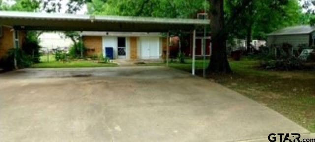 307 Lowry St, Arp, TX 75750 - view of front of property with a carport