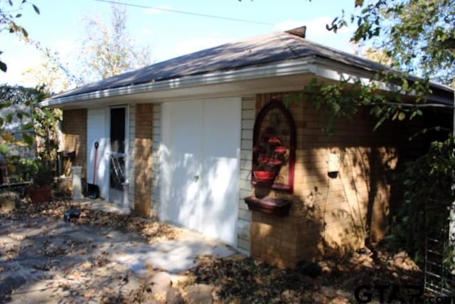 view of side of property with a garage