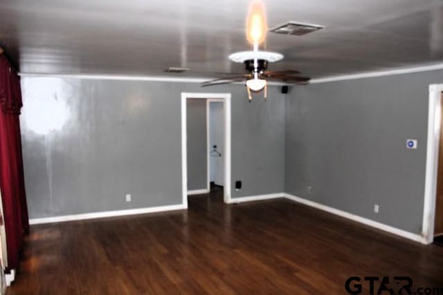 unfurnished room with ceiling fan and dark hardwood / wood-style flooring