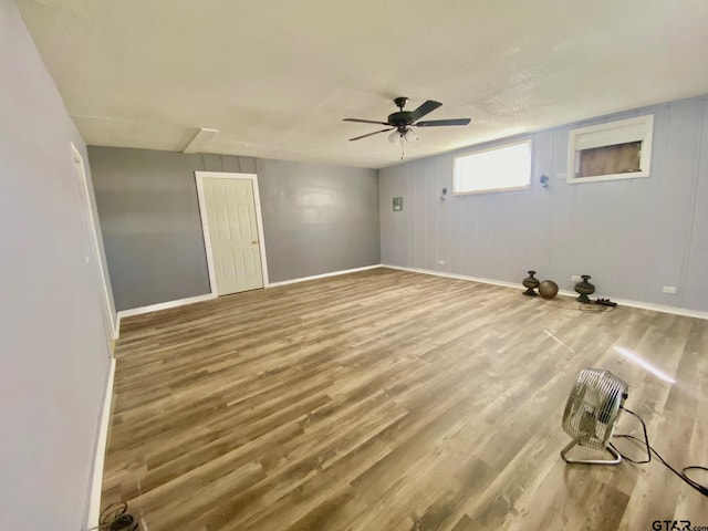 unfurnished room with wood-type flooring and ceiling fan