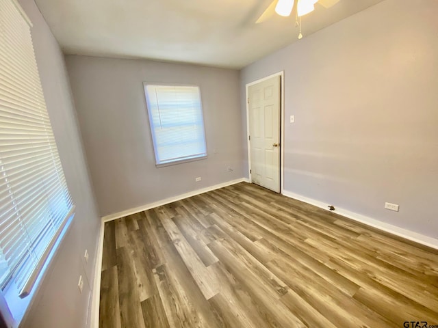 spare room featuring ceiling fan and wood-type flooring