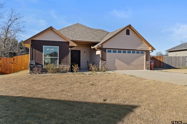 ranch-style home featuring concrete driveway, an attached garage, fence, stone siding, and a front lawn