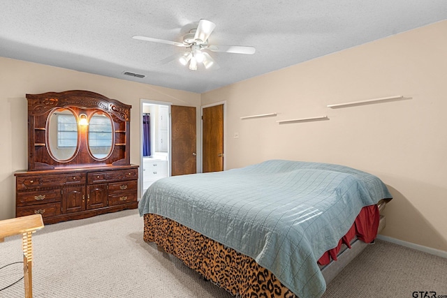 carpeted bedroom featuring visible vents, ceiling fan, a textured ceiling, and baseboards