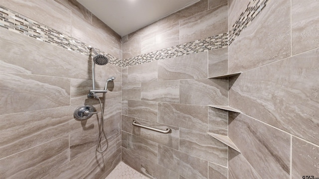 full bathroom with a tile shower