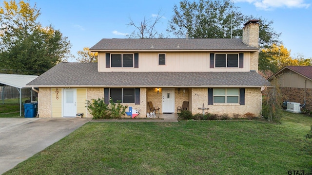 view of front of property with brick siding and a front lawn