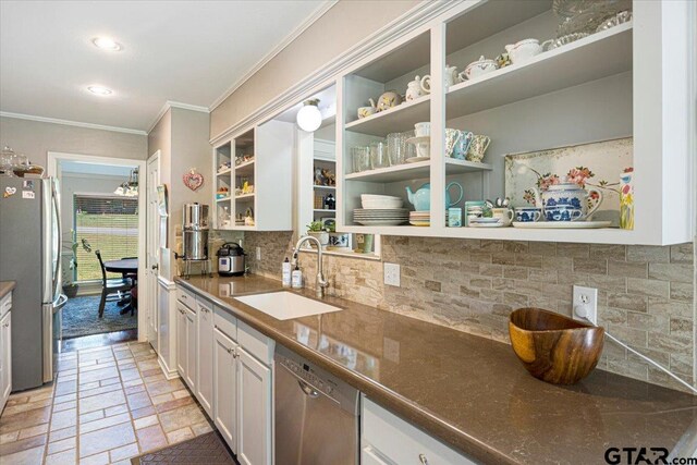 17599 Autumn Trl, Whitehouse, TX 75791 - kitchen with tasteful backsplash, open shelves, a sink, appliances with stainless steel finishes, and ornamental molding