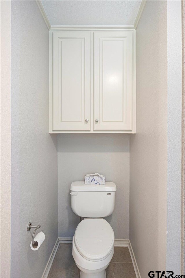 17599 Autumn Trl, Whitehouse, TX 75791 - bathroom with baseboards, toilet, and tile patterned floors