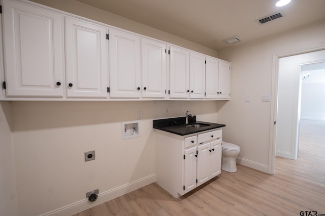 washroom featuring cabinets, hookup for a washing machine, light wood-type flooring, electric dryer hookup, and sink