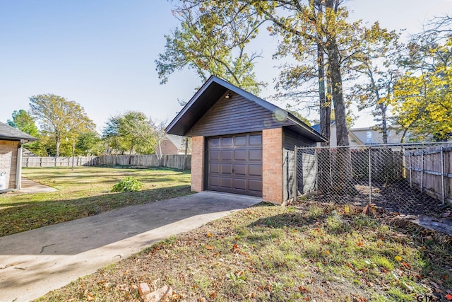 garage featuring a yard