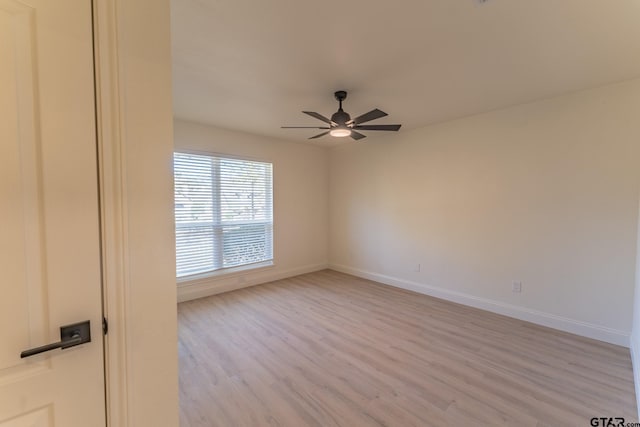 empty room featuring light hardwood / wood-style floors and ceiling fan