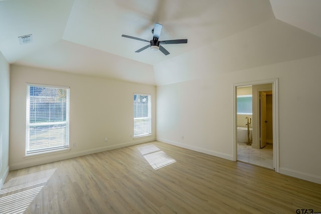 empty room with ceiling fan and light hardwood / wood-style floors