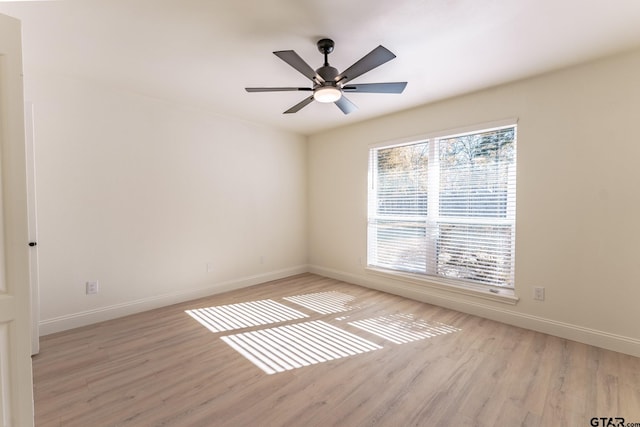 spare room featuring ceiling fan and light hardwood / wood-style flooring