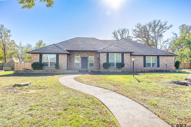 single story home featuring a front yard