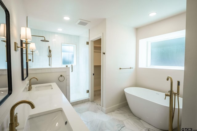 bathroom with plenty of natural light, vanity, and shower with separate bathtub