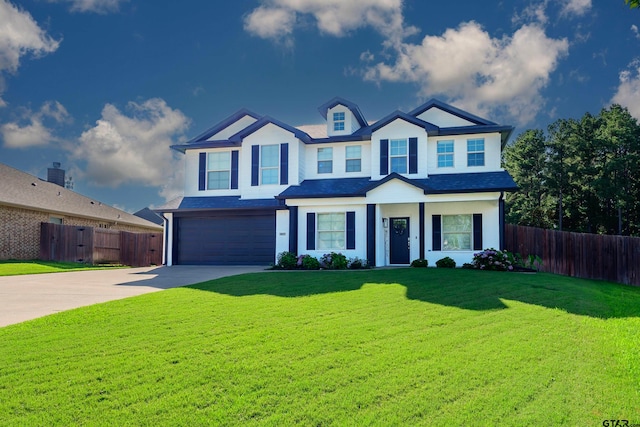 view of front facade featuring a garage and a front lawn