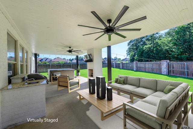 view of patio featuring outdoor lounge area and ceiling fan